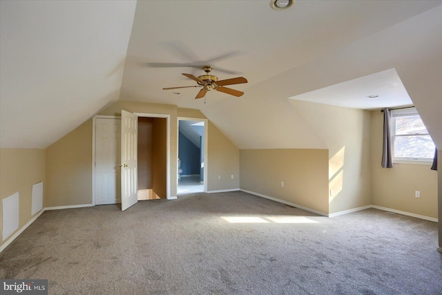 additional living space featuring vaulted ceiling, ceiling fan, and carpet