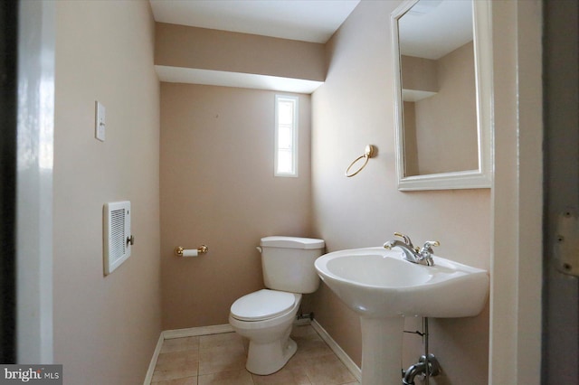 bathroom featuring tile patterned floors and toilet