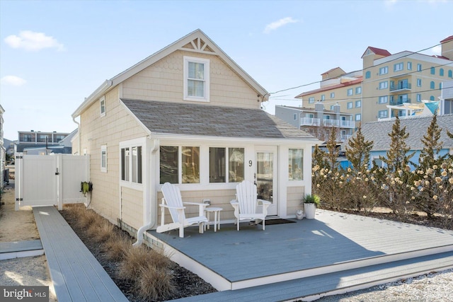 back of property with a wooden deck