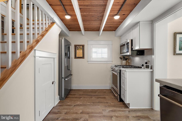 kitchen featuring wood ceiling, hardwood / wood-style floors, beam ceiling, high quality appliances, and white cabinets