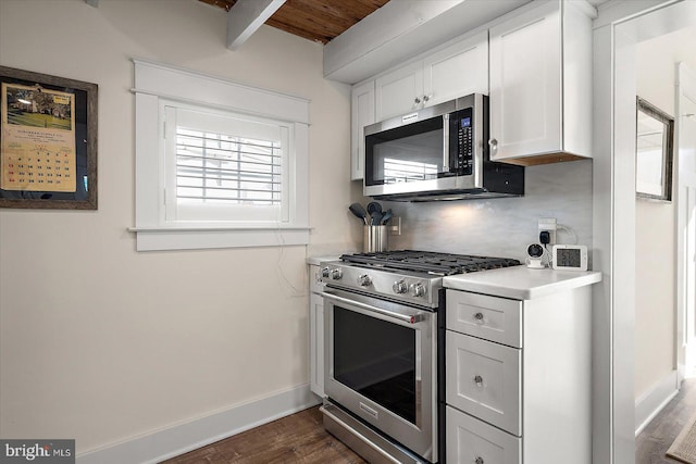 kitchen featuring stainless steel appliances, dark hardwood / wood-style flooring, decorative backsplash, and white cabinets