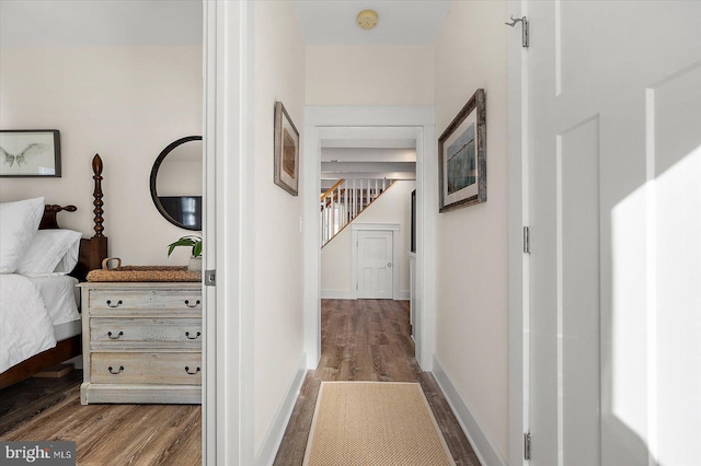 corridor featuring hardwood / wood-style floors