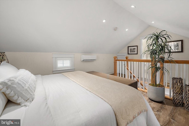 bedroom featuring hardwood / wood-style flooring, vaulted ceiling, and an AC wall unit