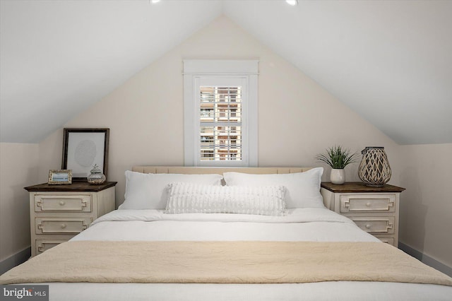 bedroom featuring vaulted ceiling