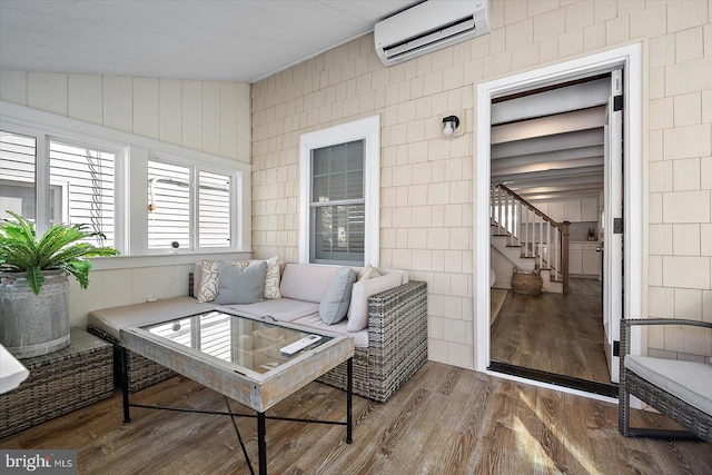 sunroom featuring a wall mounted AC