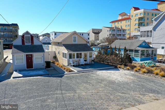 view of front of home featuring a sunroom