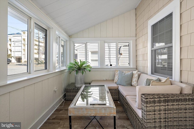 sunroom featuring lofted ceiling