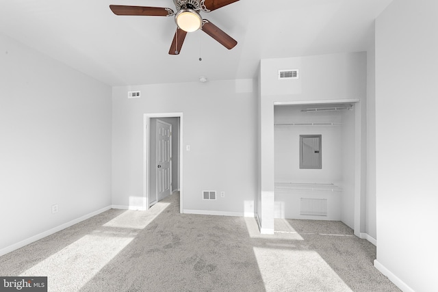 empty room with light colored carpet and ceiling fan