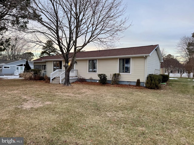 view of front of house with a lawn