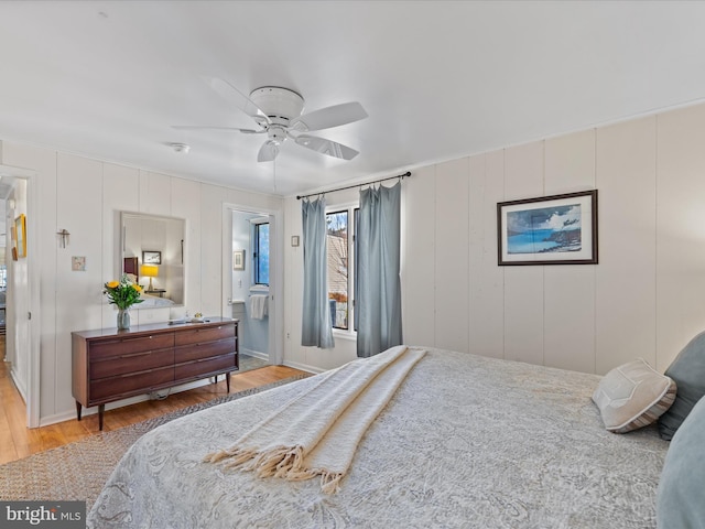 bedroom with ceiling fan and wood-type flooring