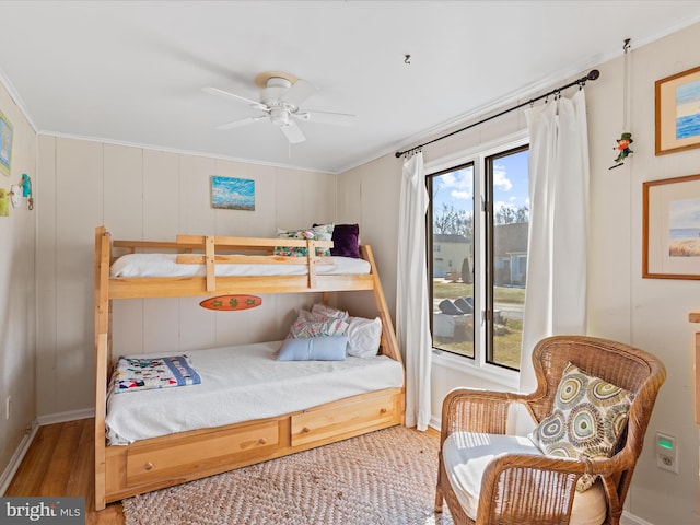 bedroom featuring wood-type flooring and ceiling fan