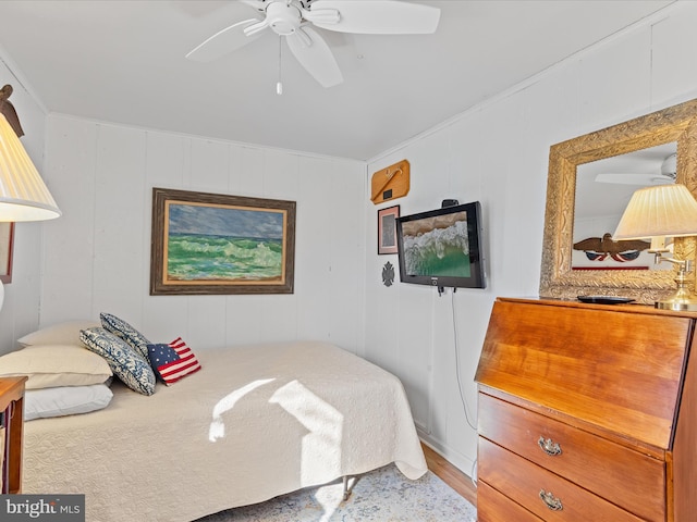 bedroom featuring ceiling fan and hardwood / wood-style floors