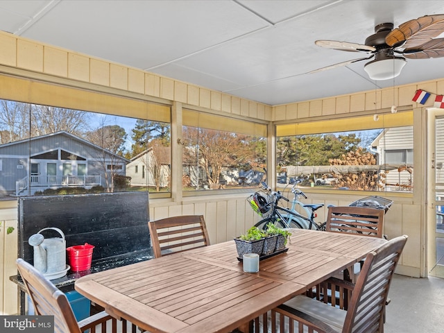 sunroom / solarium with ceiling fan and a healthy amount of sunlight