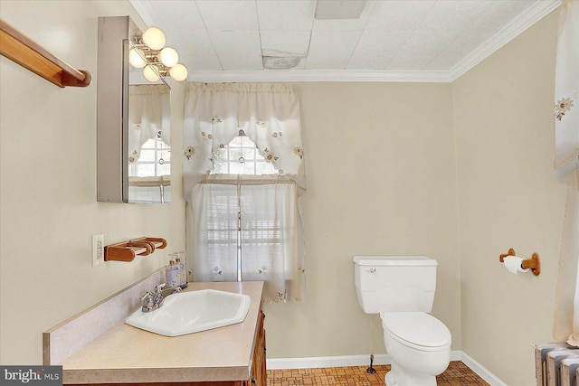 bathroom featuring ornamental molding, toilet, radiator, and vanity