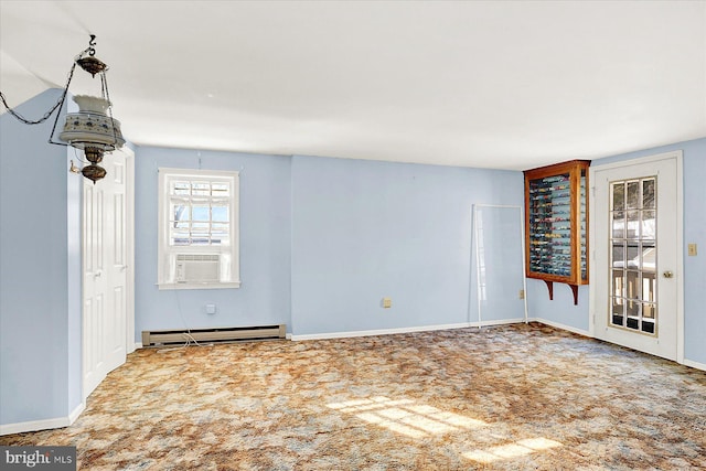 spare room featuring cooling unit, carpet floors, and baseboard heating