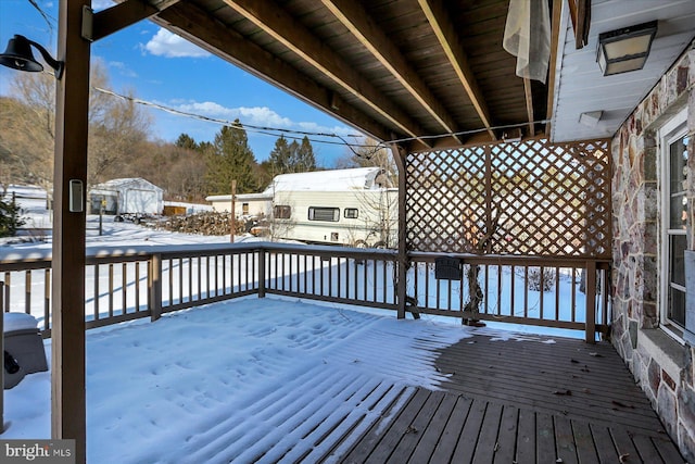 view of snow covered deck