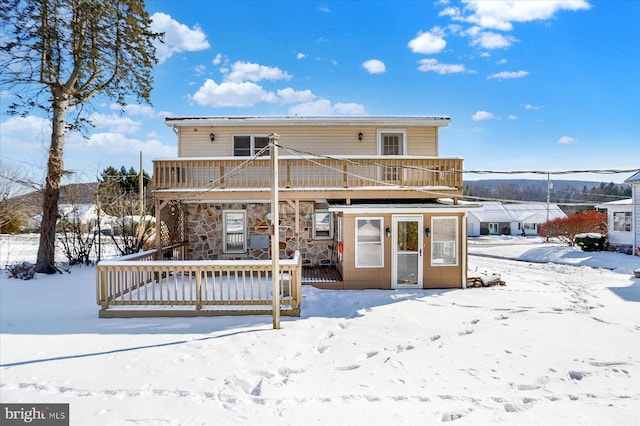 snow covered house with a balcony