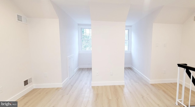 corridor featuring light hardwood / wood-style floors