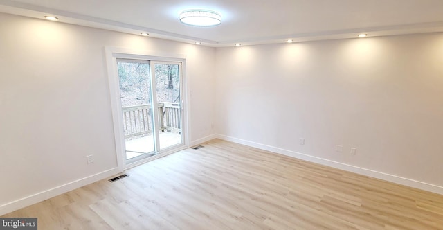 unfurnished room featuring light hardwood / wood-style flooring