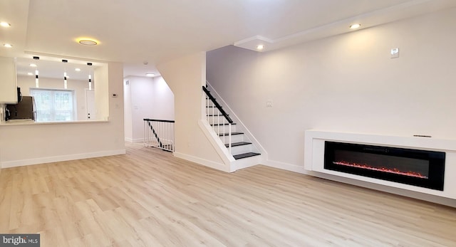 unfurnished living room featuring light hardwood / wood-style flooring