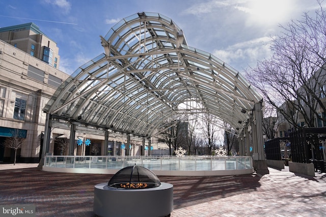 view of community featuring a fire pit