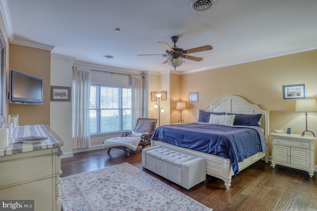 bedroom with ceiling fan, ornamental molding, and dark hardwood / wood-style flooring