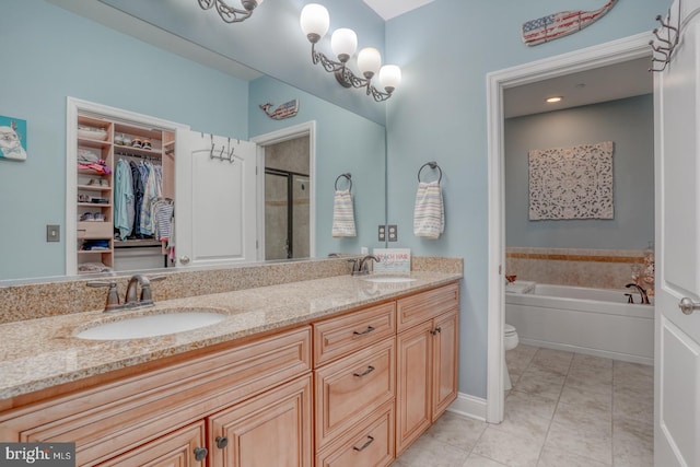 full bathroom featuring vanity, toilet, separate shower and tub, and tile patterned flooring