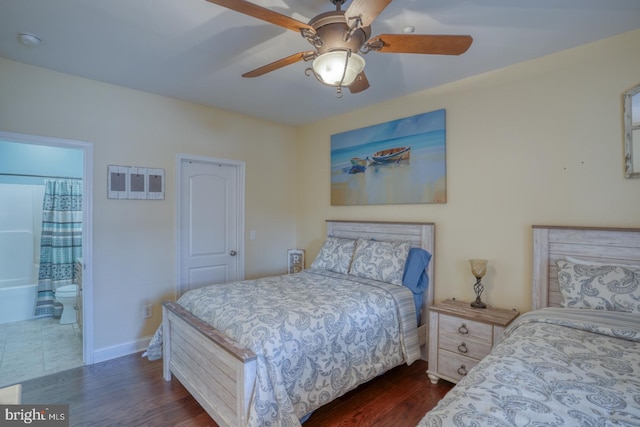 bedroom with connected bathroom, dark hardwood / wood-style floors, and ceiling fan