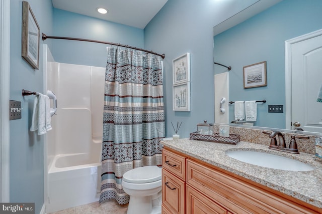 full bathroom with shower / tub combo with curtain, vanity, toilet, and tile patterned flooring