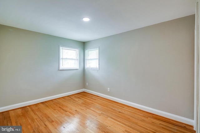 unfurnished room with light hardwood / wood-style floors