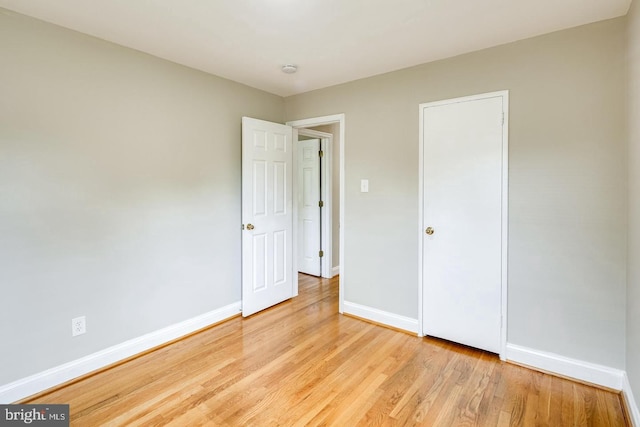 unfurnished bedroom featuring light wood-type flooring