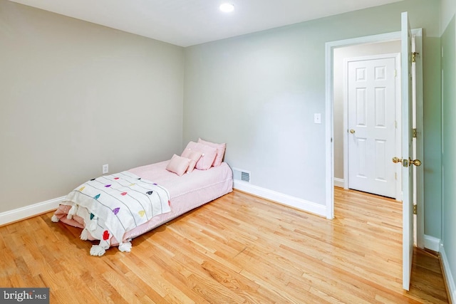 unfurnished bedroom with light wood-type flooring