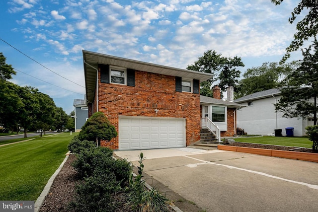 view of front of property with a garage and a front yard