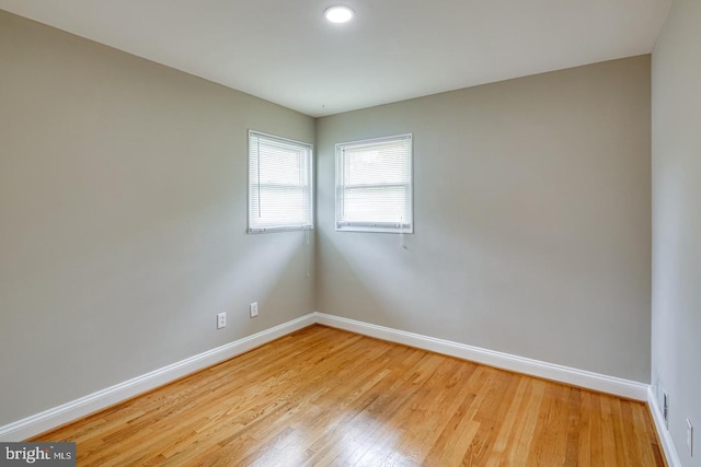 unfurnished room with light hardwood / wood-style floors