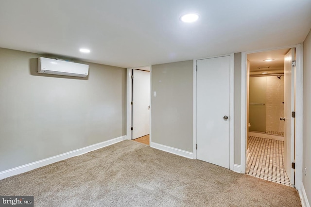 basement featuring light carpet and a wall unit AC