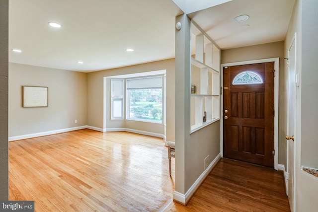 foyer with wood-type flooring