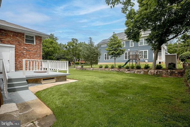 view of yard with a wooden deck