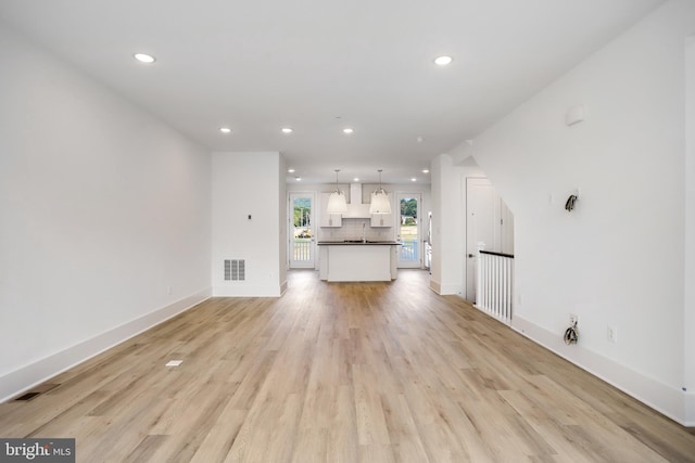 unfurnished living room featuring light hardwood / wood-style flooring