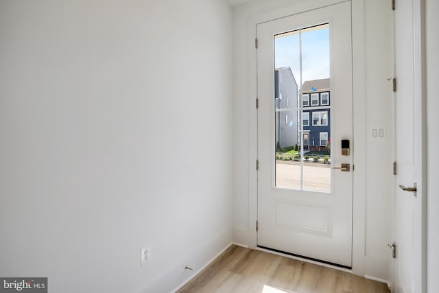 entryway with light hardwood / wood-style floors