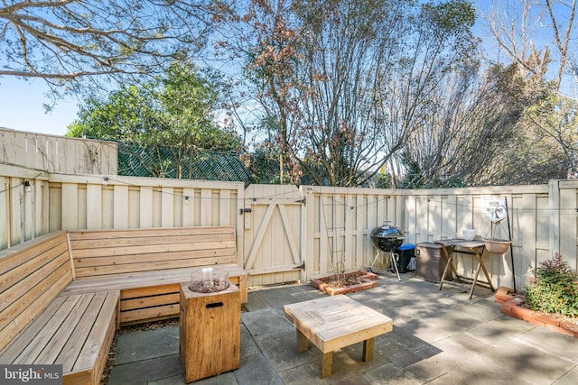 view of patio with a grill