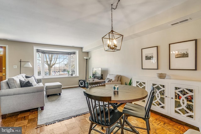 dining room featuring light parquet flooring