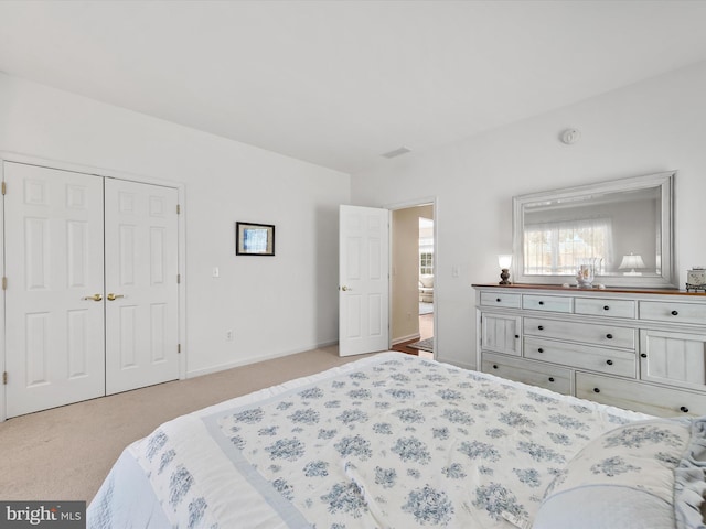 carpeted bedroom featuring a closet