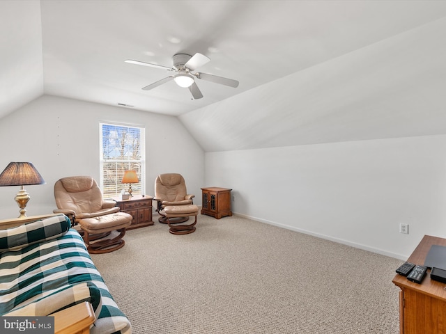 living area featuring vaulted ceiling, ceiling fan, and carpet