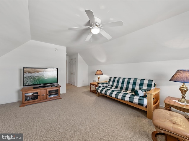 living room featuring vaulted ceiling, ceiling fan, and carpet