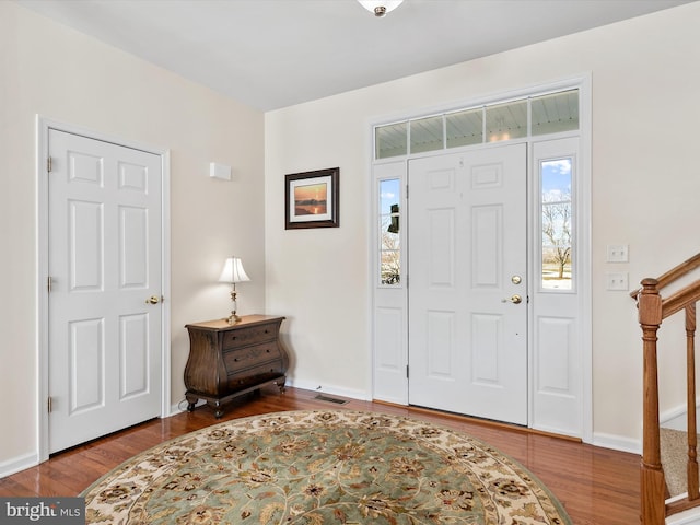 entrance foyer with hardwood / wood-style floors