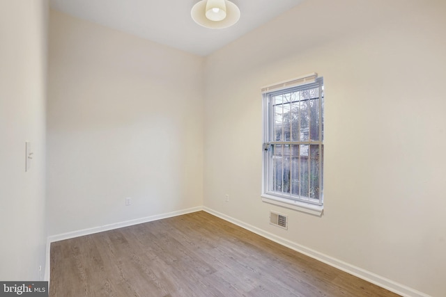 spare room with light hardwood / wood-style floors