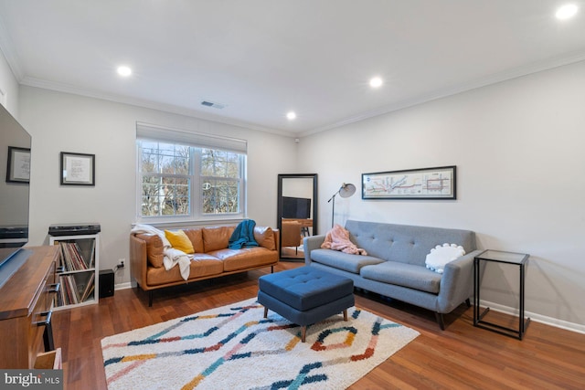 living room with crown molding and dark hardwood / wood-style floors