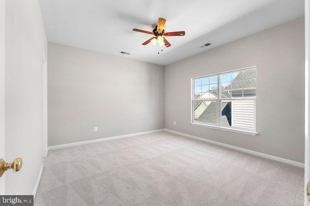 unfurnished room with light carpet, baseboards, and visible vents