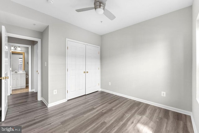 unfurnished bedroom with ceiling fan, a closet, baseboards, and dark wood-style flooring