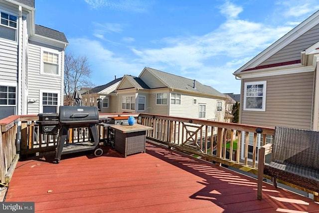 deck featuring a grill and a residential view